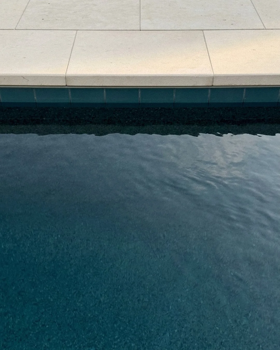 Clear pool water in afternoon light